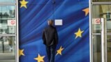 Belgium - A man looks at a sign announcing that a door is closed for security reasons at the European Commission’s Berlaymont building in Brussels, on September 22, 2014. 