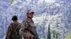 Pakistani Army soldiers stand guard in the Swat Valley.