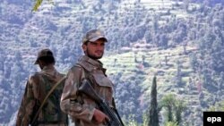 Pakistani army soldiers stand guard in the Swat Valley