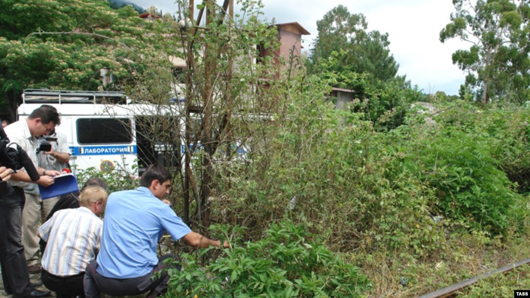 Investigators at the site of a June 29 blast at Gagry
