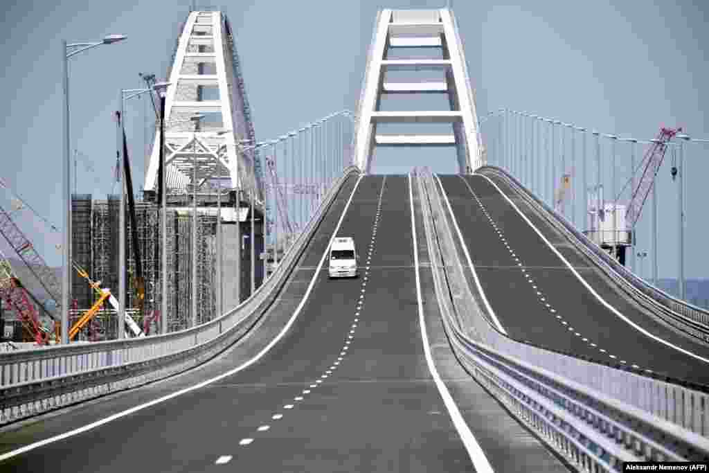 A lone vehicle drives down the Crimean Bridge prior to the opening ceremonies on May 15.