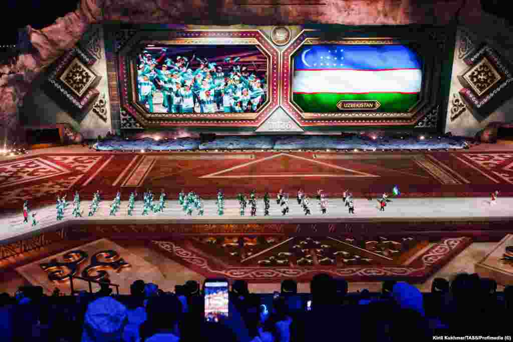 The Uzbek squad is introduced during the opening ceremony.More than 100 national teams are reportedly taking part in the games, though the official list of "104" countries counts Cambodia twice.