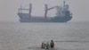A vessels lies in the Strait of Hormuz near the Iranian port of Bandar Abbas on June 30.
