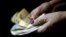 Azerbaijan -- A woman holds manat banknotes, national currency of Azerbaijan, in this photo illustration taken on January 18, 2016