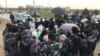 Жители села Алтынтобе в кольце полицейских. 4 апреля 2021 года.