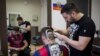 SERBIA -- Serbian hairdresser Mario Hvala creates a hair tattoo showing the portrait of Argentinian football player Lionel Messi on the head of a football fan in Novi Sad, Serbia, on June 10, 2018.