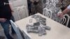 Armenia - Cash purportedly found in the home of the chief executive of a customs brokerage firm arrested by the National Security Service. 