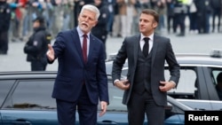 Czech President Petr Pavel (left) welcomes French President Emmanuel Macron at Prague Castle in Prague on March 5.