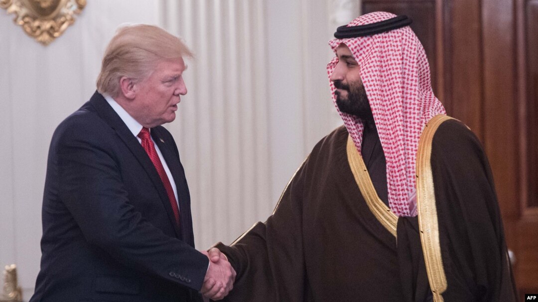 U.S. President Donald Trump (left) and Saudi Deputy Crown Prince Mohammed bin Salman shake hands in the State Dining Room before lunch at the White House on March 14.