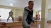 A gunman opens fire at a military draft office in Ust-Ilimsk in this screen grab obtained from social media.
