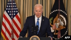 US President Joe Biden speaks about his administration's efforts to fight crime and make communities safer, in the State Dining Room of the White House in Washington, DC, on February 28, 2024. (Photo by Jim WATSON / AFP)