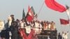 Leaders of various Pakistani political parties addressing protestors in front of the Pakistani parliament in Islamabad on October 9.