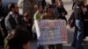 პლაკატი საპროტესტო აქციიდან