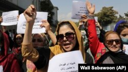 Women gather to demand their rights under Taliban rule during a protest in Kabul on September 3.