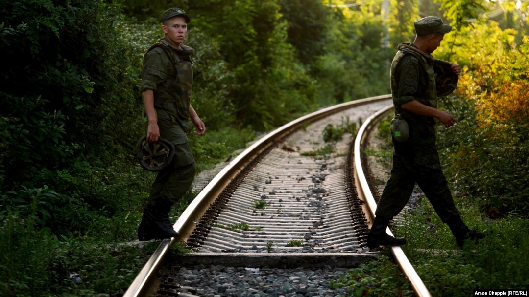 Russian soldiers cross rail tracks in Gudauta, Abkhazia, where a Russian military base is located (file photo). 