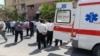 Iranian emergency workers attend the aftermath of a deadly attack on a courthouse in the southeastern city of Zahedan on July 26. 