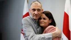 Belarusian opposition activist Syarhey Tsikhanouski embraces his wife, opposition leader Svyatlana Tsikhanouskaya, after his release from prison in June.