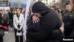 People gather to light candles and grieve following a fire a nightclub in Kocani, North Macedonia, which killed dozens of people. 