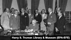 U.S. President Harry S. Truman signs a proclamation declaring into effect the 12-nation North Atlantic Treaty in the Oval Office of the White House on August 24, 1949.