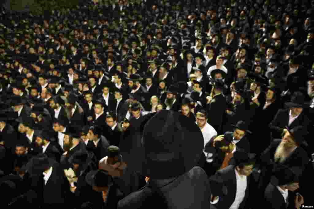 Ultra-Orthodox Jewish men attend a demonstration near recruitment offices in Jerusalem against plans to enlist men from their community into the military. (AFP/Daniel Karmann)