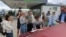 Ukraine -- People put their names on a list to join the queue for fuel at a gas station