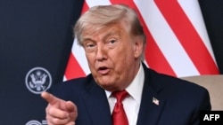 US President Donald Trump speaks during a bilateral meeting with Egypt's President on the sidelines of the G7 summit, in Evian, eastern France, on June 17.