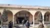 Soldiers patrol near a mosque next to Bagram that was damaged by the attack on December 11.