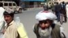 Afghanistan – Afghan elder is walking on the footpath in Kabul, 20Jun2011