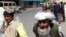Afghanistan – Afghan elder is walking on the footpath in Kabul, 20Jun2011