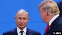 U.S. President Donald Trump (right) and Russian President Vladimir Putin at a G20 leaders summit in Buenos Aires in 2018. 