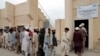 Internally displaced refugees queue for aid at the entrance of a food distribution center in Bannu. (file photo) 