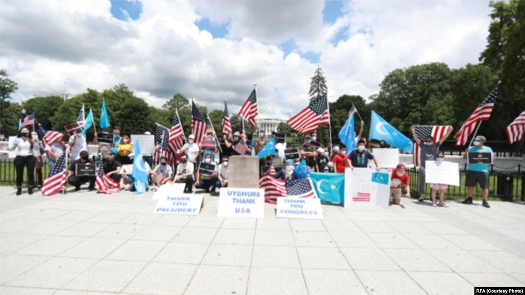 Uyghurs hold a rally in front of the White House in Washington, calling for sanctions on Chinese officials, in June 2020.