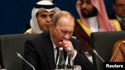 Russian President Vladimir Putin yawns at the start of the plenary session at the G20 summit in Brisbane, Australia, on November 15.