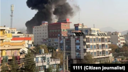 Smoke rising from a building in the Taimani area of Kabul after Pakistani air strikes.