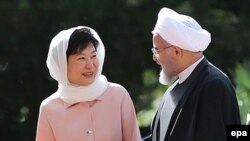 South Korean President Park Geun-hye (left) and Iranian President Hassan Rohani said they aim to triple their trade to $18 billion a year.