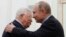 Russian President Vladimir Putin (right) embraces Palestinian Authority President Mahmud Abbas during a meeting at the Kremlin in Moscow on February 12.