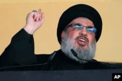 Hezbollah leader Hassan Nasrallah addresses a crowd in a southern suburb of Beirut on October 24, 2015.