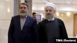 IRAN -- Iranian President Hassan Rohani (R) walks with Interior Minister Abdolreza Rahmani Fazli at the Interior Ministry in Tehran, December 21, 2015