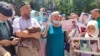 Supporters demand the release of Baibolat Kunbolat outside the Chinese Consulate in Almaty. 