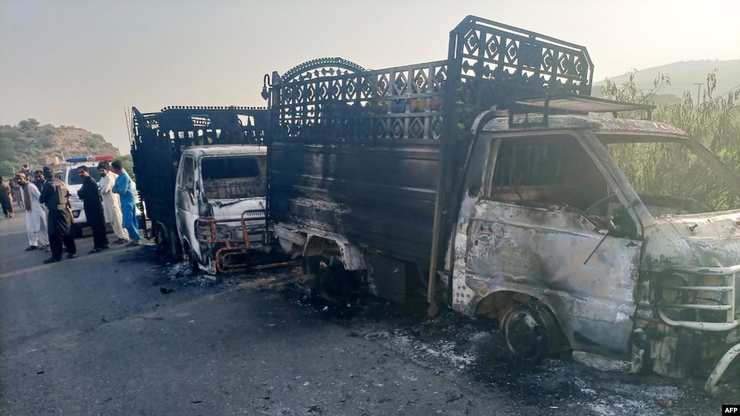 Gunmen burned several vehicles before fleeing the scene in the Musakhail district of Pakistan's Balochistan Province on August 26.