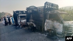 Gunmen burned several vehicles before fleeing the scene in the Musakhail district of Pakistan's Balochistan Province on August 26.