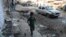 A boy walks at the site of a suicide bomb attack near a Shi'ite mosque in Kabul on September 29.