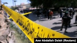 Egypt - Security officials and investigators inspect the scene of a bomb blast in Giza Al Haram