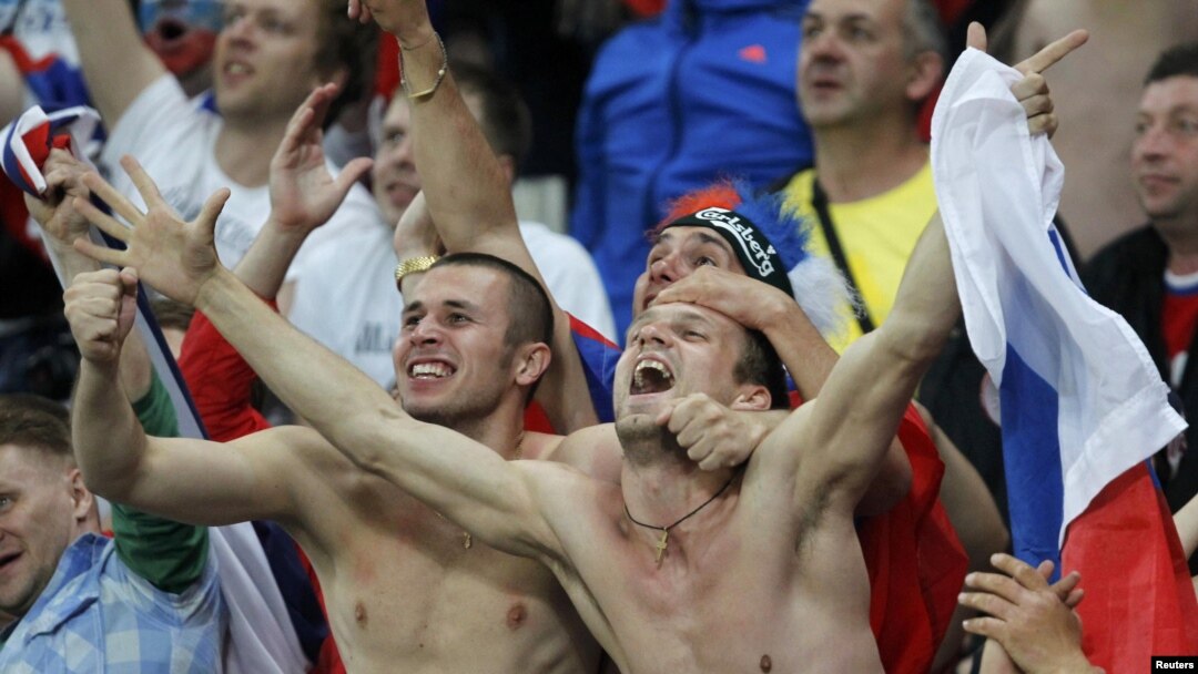 Russian soccer fans celebrating during their country's 4-1 win over the Czech Republic in Wroclaw, Poland. 
