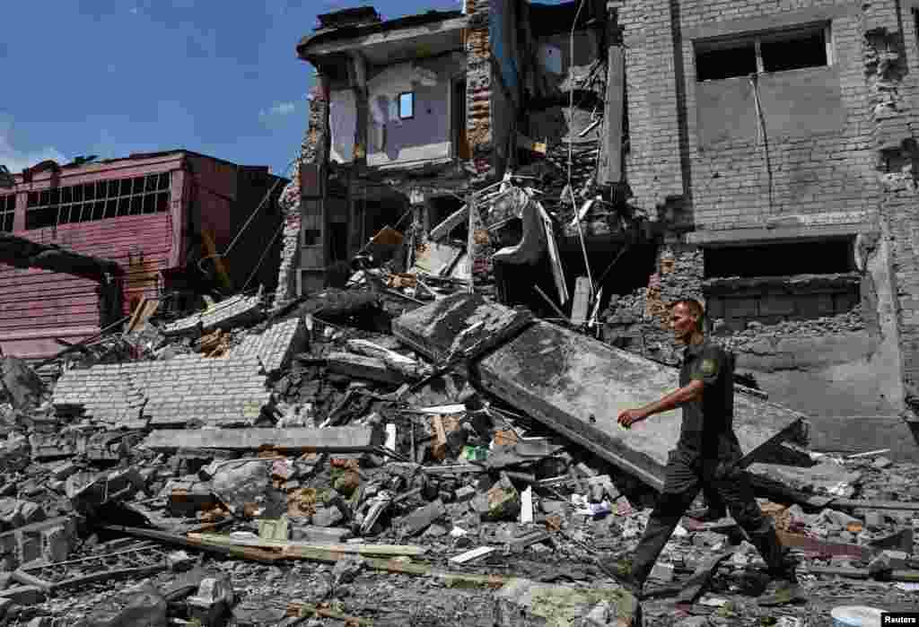 A Ukrainian soldier walks past a prison that was hit by a Russian air strike in the Zaporizhzhya region.