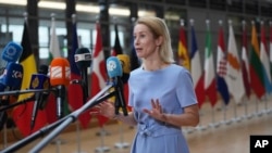 European Union foreign policy chief Kaja Kallas speaks with the media as she arrives for a meeting of EU foreign ministers on June 23. 