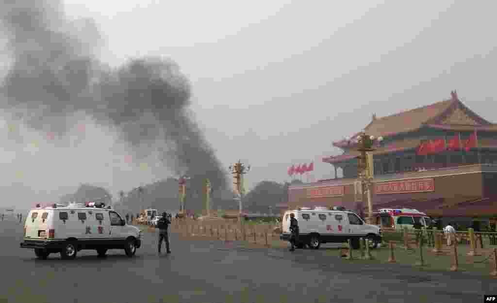 Police cars block off roads around Tiananmen Square in Beijing after a deadly incident at one of China's most-visited sites in which a car crashed into a crowd, killing several people and injuring dozens more.