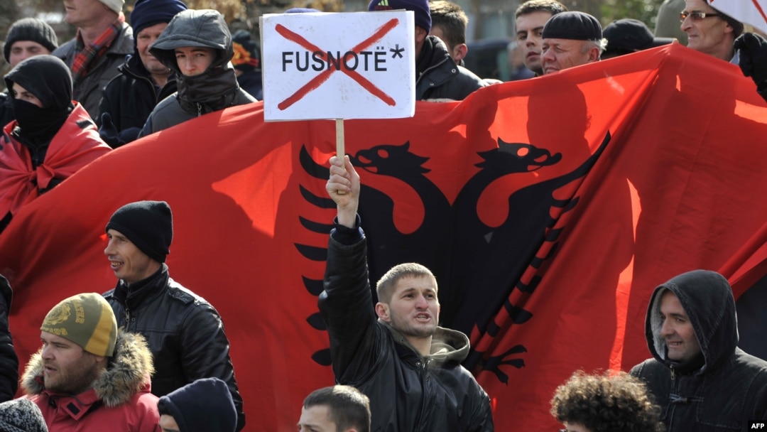 An ethnic Albanian protester objects to the asterisk at a demonstration in Pristina in February 2012.