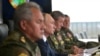 Russian President Vladimir Putin (center), Defense Minister Sergei Shoigu (left) and the chief of the General Staff of Russia's armed forces, Valery Gerasimov (right), observe the military exercises in September 2021.