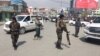 AFGANISTAN -- Afghan security forces keep watch near the site of an explosion in Kabul, March 9, 2018